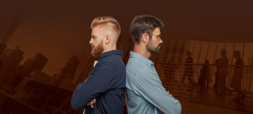 Two men standing back to back on a background of a crowd.